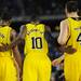 Michigan junior Tim Hardaway Jr. reaches, center, huddles freshman Glenn Robinson III and freshman Mitch McGary during a break in action in overtime at Cowboys Stadium in Arlington, Texas on March 29, 2013. Melanie Maxwell I AnnArbor.com